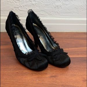 Black heels with bows.